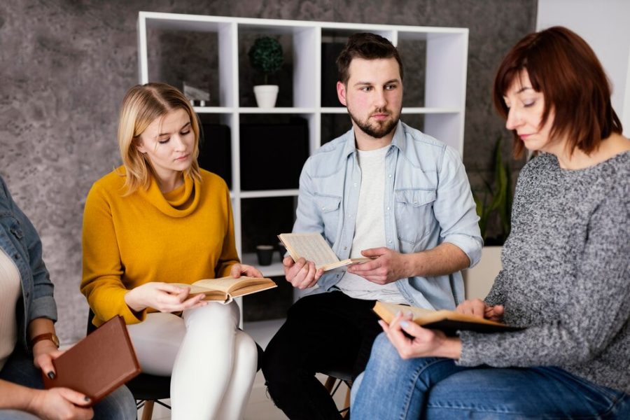 group-people-reading-books-therapy-session_23-2148856223